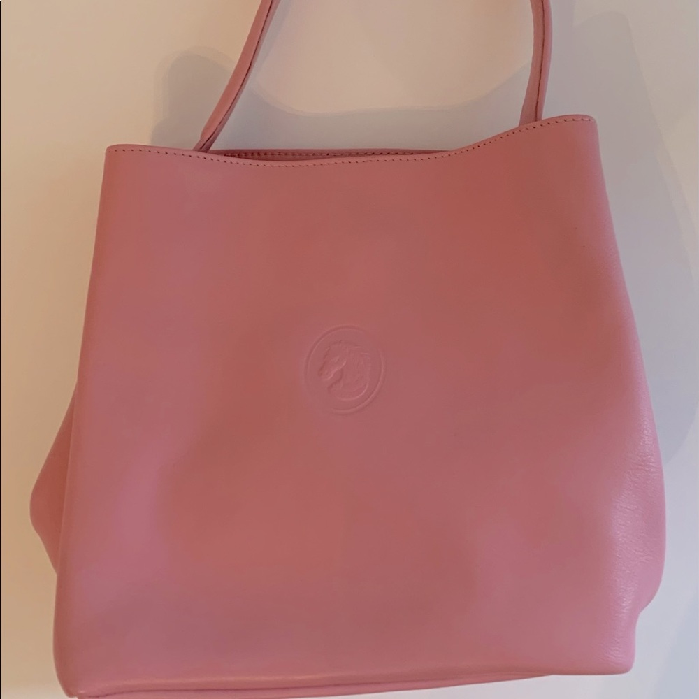 Pink leather handbag with horse emblem from Europe